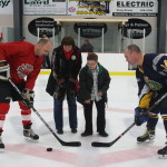 Sharon Riley (Montague Rotary) and Colton drop the puck!