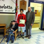 Joe Weatherby, President Student Council presents to Luke and Rotarian Kingsley Lewis