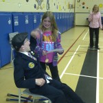 Luke sister grace presenting luke with a cheque from westwood primary