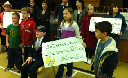 Kindergarten class kicks of day in Souris with cheque